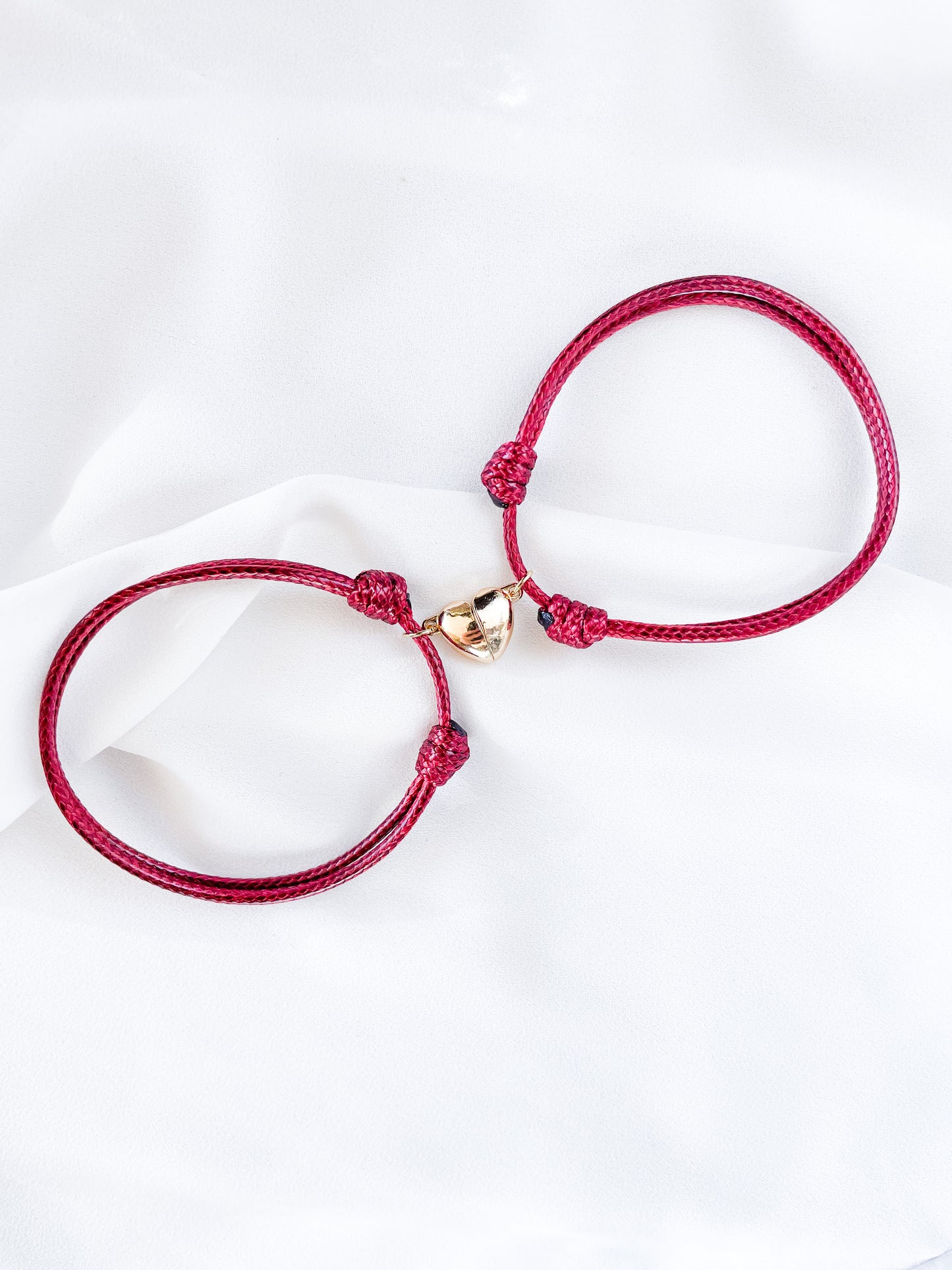 Pulseras de iman rojo vino